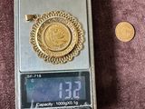 a small scale with a coin on it and a coin in front of it