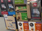 boxes of coffee are stacked on top of each other in a store