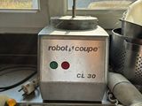 a robot that is sitting on a counter next to a window