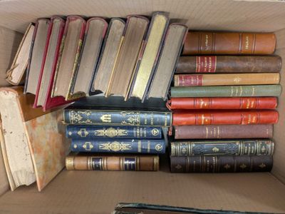 a box full of old books sitting on a table