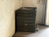 a small air conditioner in a corner of a room