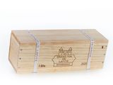 a wooden box with a label on it sitting on a white surface