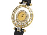a close up of a gold watch with diamonds on a black strap