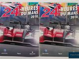 these are two books of racing cars on display on a table