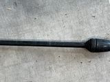 an image of a black handle on a concrete floor