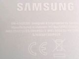 a close up of the back of a white samsung phone