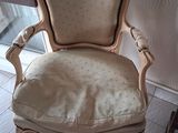 a chair that is sitting in the corner of a room