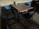 a table and chairs in the corner of a restaurant