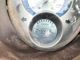 a close up of a meter on the side of a car
