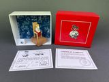 an image of a christmas ornament in a red box