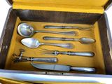 a box with a variety of silverware in it