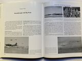 an open book with pictures of military planes on it