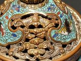 a blue and gold vase with a dragon on it