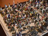 a lot of figurines that are sitting on a table