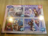 a close up of a puzzle board with four pictures of frozen characters