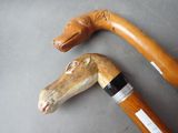 two walking canes that are sitting next to each other