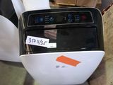 a black and white toaster sitting on top of a table