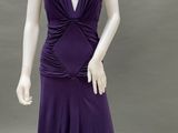 an image of a mannequin wearing a purple dress with ruffles