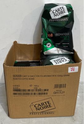 a box of coffee that is sitting on the floor