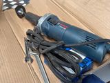 a box that has a drill and a cord on it