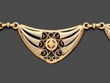 bracelet plaqué or composé de trois perles de forme triangulaire enfilées sur un fil