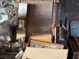 a pile of old books and other items on a table