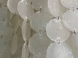 a close up of a bunch of white plastic beads