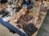 a table that has a lot of antique items on it