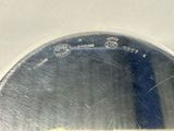 a close up of a silver plate with a blue handle