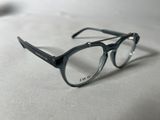 a pair of glasses sitting on a white surface