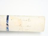 a roll of paper with writing on it sitting on a table