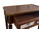 a small table with a drawer underneath it