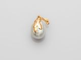 a white pearl and gold pendant on a white background