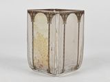 a glass vase with a gold rim and a silver rim