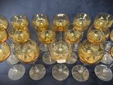 a lot of wine glasses that are sitting on a table