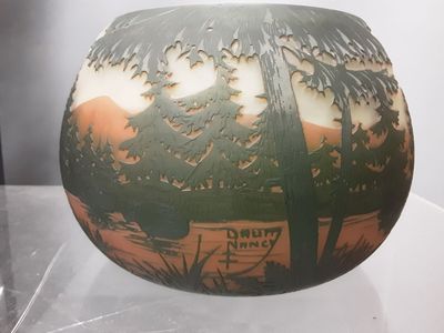 a vase that has a picture of a tree on it