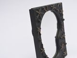 a black frame with stars on it on a white surface