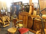 a room with a lot of furniture and a chair