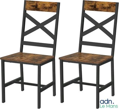 a pair of wooden chairs sitting next to each other on a white background