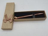 a box with a pen inside of it on a table