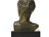 a bronze bust of a woman on a marble base