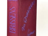 the book is red with blue writing on the cover