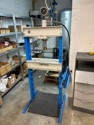 a machine that is sitting in a room with shelves