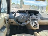 beige interior of a car with a steering wheel and dashboard