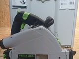 the green and black electric tool is sitting on the table