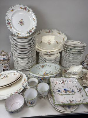 many different types of china plates and bowls on the table