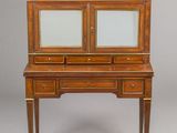 an antique writing desk with two drawers and a marble top