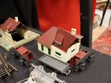 a lot of toy trains on a table with a red background