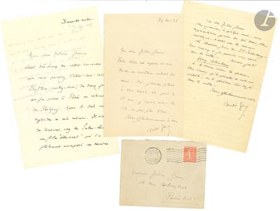 several old letters and envelopes are sitting on a white surface