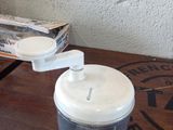 a blender sitting on a table with a box of food in front of it